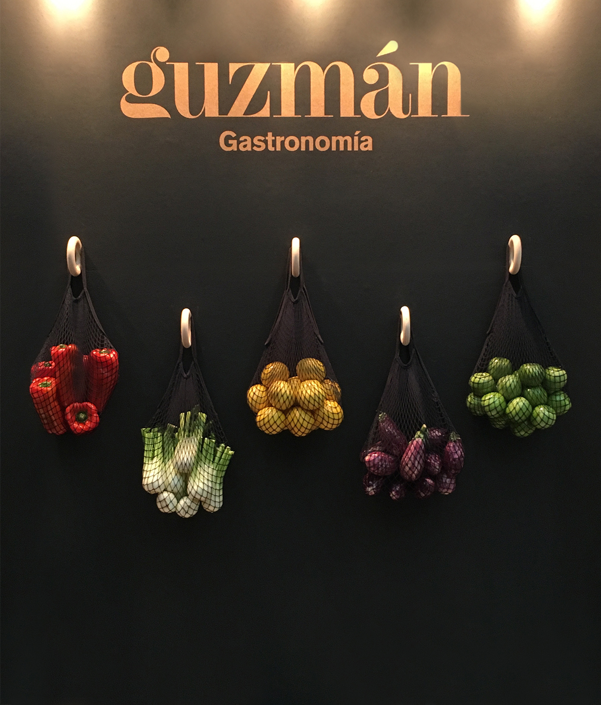 Guzmán Gastronomía - stand fair by Studio: Gris - Creative Work - $i